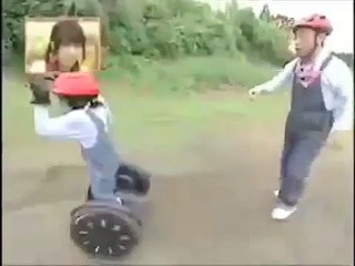 chimpanzee riding on a segway
