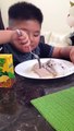 kid eating vietnamese food banh cuon