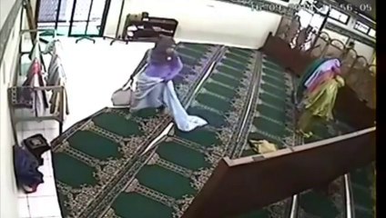 OMG!!! What is the Lady doing inside Mosque premises ????