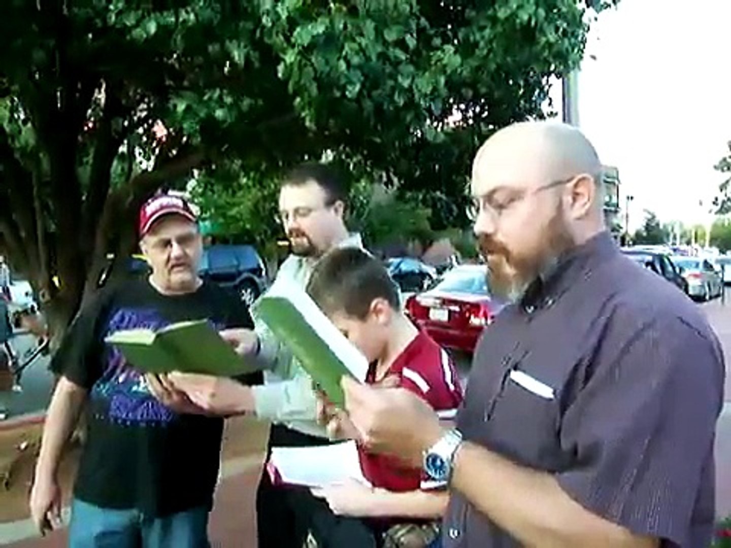 ⁣Singing before street preaching