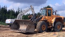 Big Excavators And Dumpers Moving Dirt