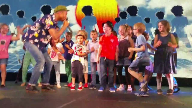 Kid dances alongside Pharrell Williams in a hilarious manner