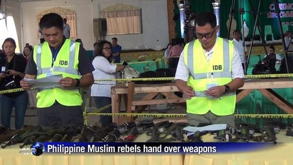Philippine Muslim rebels hand over weapons in push for peace