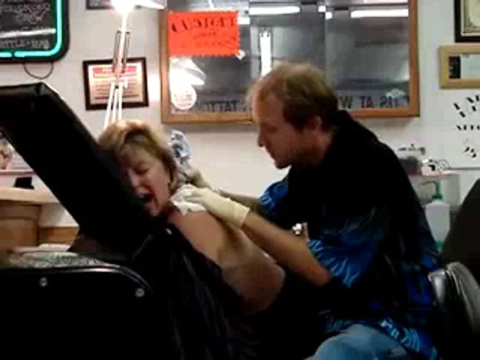Woman Screaming While Getting A Tattoo