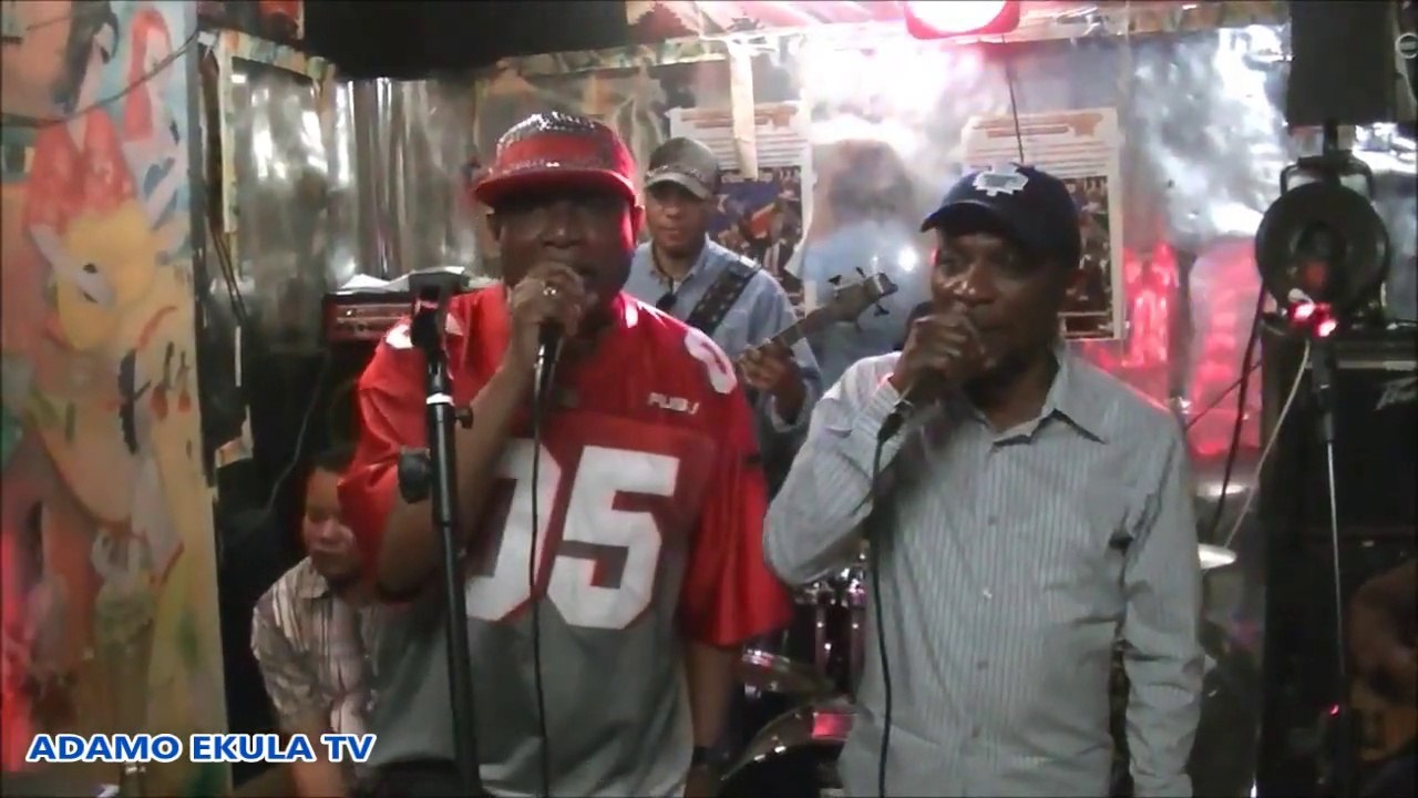 ADAMO EKULA ET MALAGE DANS MA BIBI (SHIMITA ET GRAND ZAIKO) CHEZ AFRICA MOTO KIMPWANZA