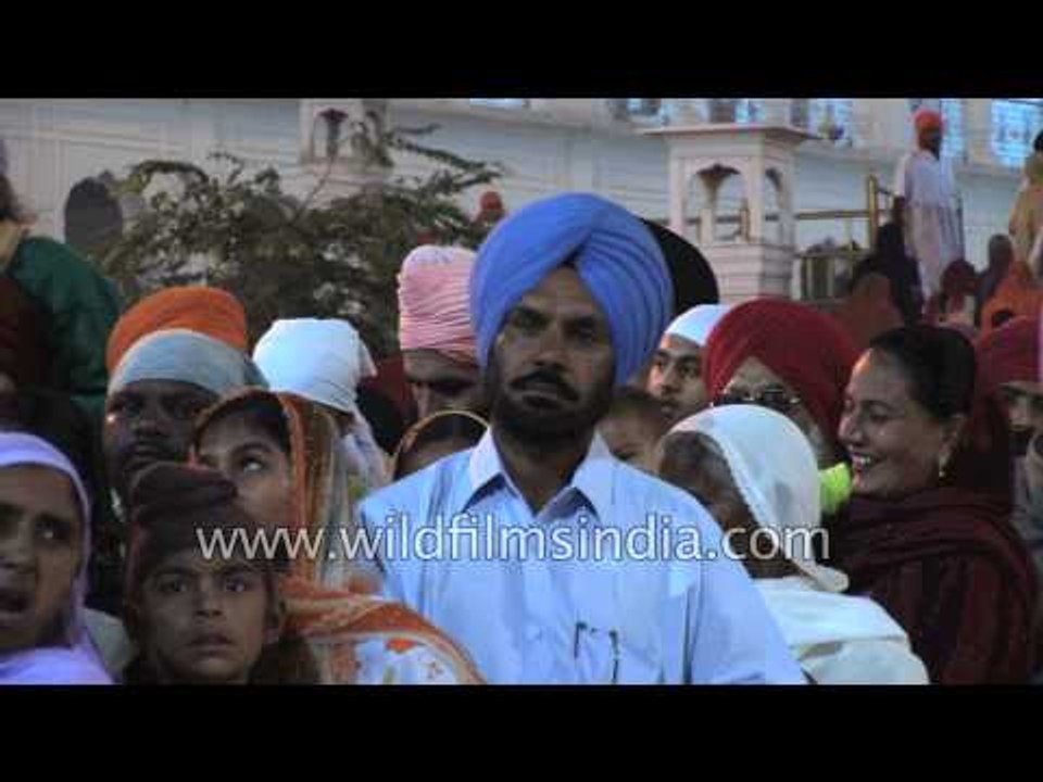 Devotees gather to pay obeisance at the Sikh shrine Golden Temple, Punjab