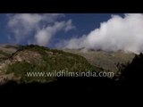 Clouds moving over the Himalayan mountains en route Lamkhaga Pass