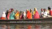 Indian devotees take boat ride on the holy Ganges River - Varanasi