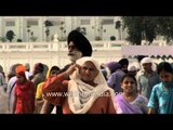 Devotees gather to pay obeisance at the Sikh shrine Golden Temple, Punjab