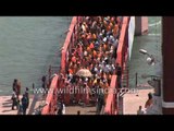 Hindu devotees arrive at river Ganges to take holy dip - Kumbh Mela