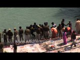 Hindus bathe in a sacred river Ganges during Maha Kumbh Mela