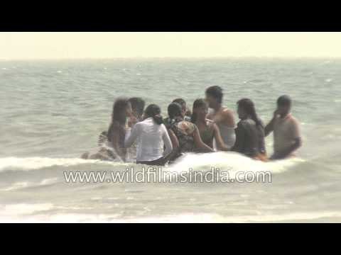 Visitors frolicking at a beach in India