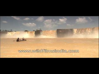 Boatmen rowing wooden boat at Chitrakoot Falls, Chhattisgarh