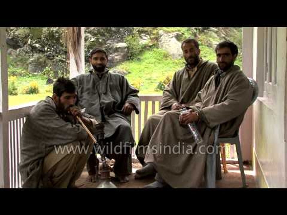 Village man smokes Zizir, the Kashmiri hookah