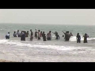 Gujaratis enjoy a dip in the Arabian Sea