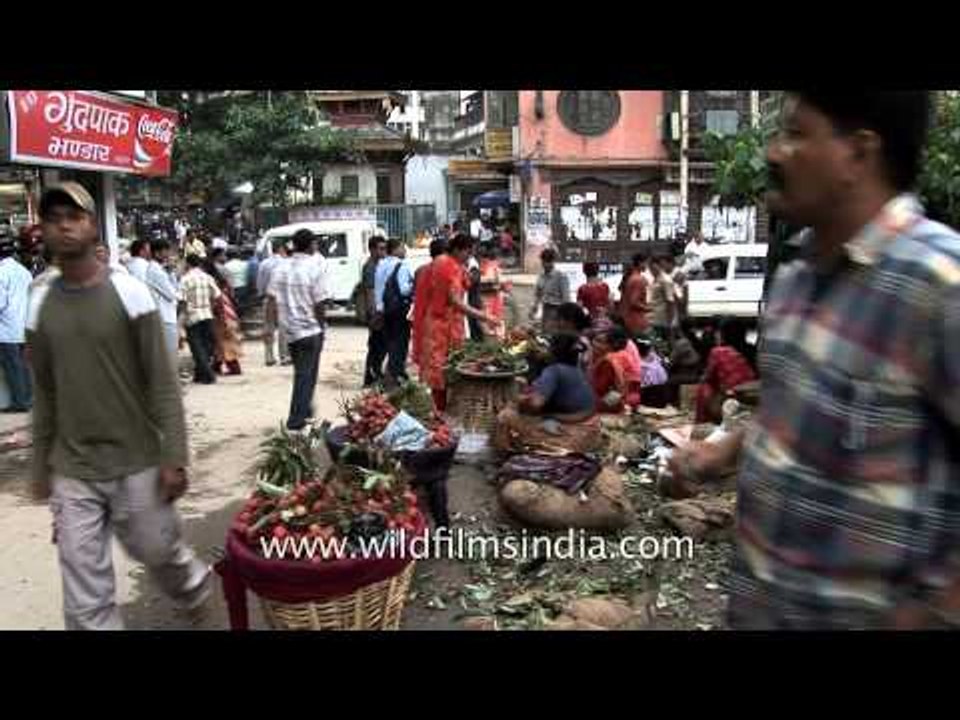 Nepali women selling lychees at a local market in Kathmandu city