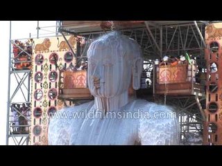 Jain devotees pour milk over the monolithic statue of Bahubali : Mahamastakabhishek, Karnataka