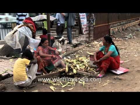 Women sell bhutta or roasted corn-on-the-cob in Kathmandu