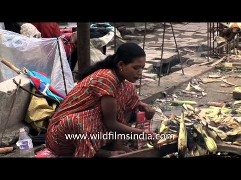 Nepali woman sells roasted bhutta/corn on Kathmandu street