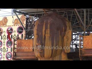 Anointment of Gomateshwara statue with sandalwood paste: Mahamastakabhishek, Karnataka