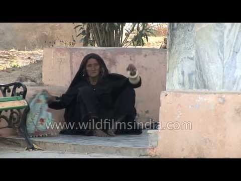 Old Vagadia Rabari woman prays at Shri Koteshwar Mahadev Temple in Kutch, Gujarat