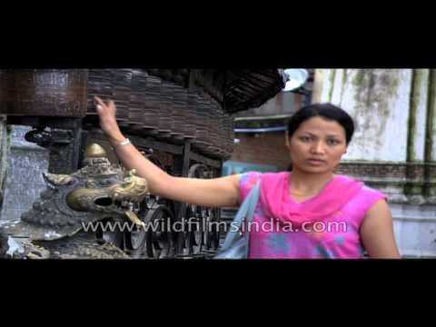 Devotees spinning prayer wheels at Swayambhunath temple - Kathmandu