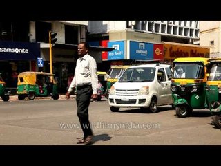 Jay walker and busy traffic near Siddi Saiyyed Masjid,  Ahmedabad