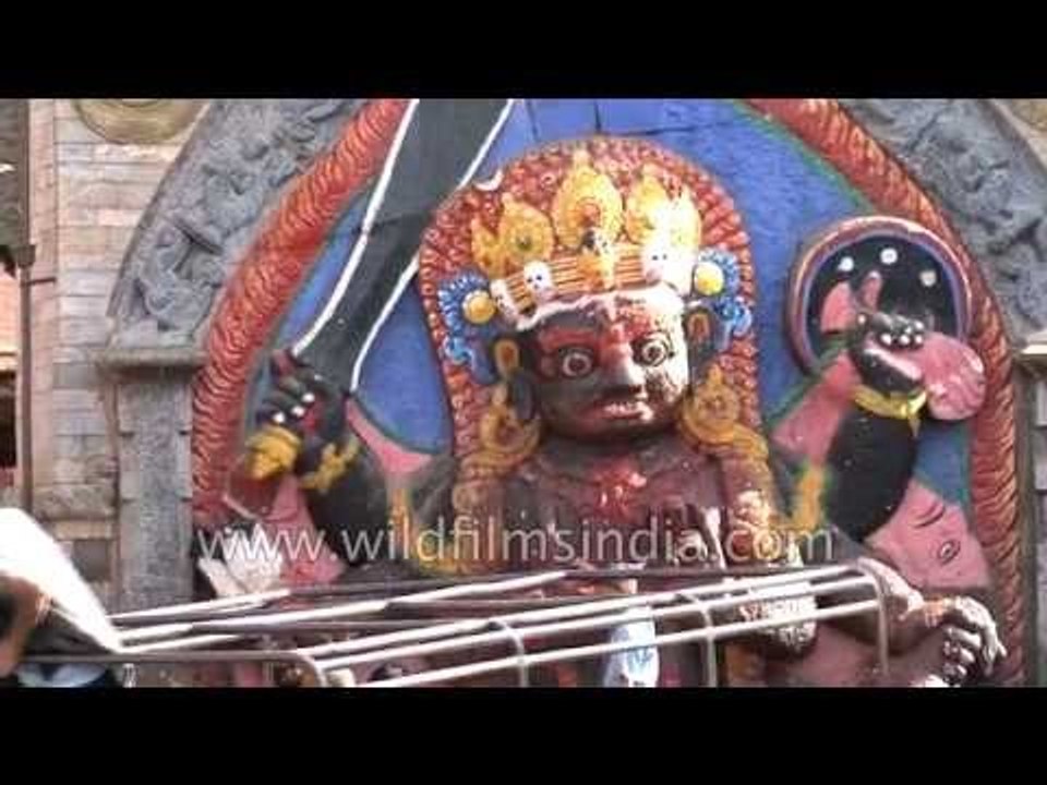 People worship 'Kala Bhairava' statue in Durbar Square, Nepal