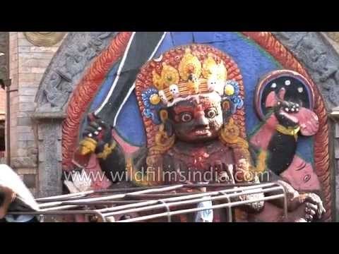 People worship 'Kala Bhairava' statue in Durbar Square, Nepal