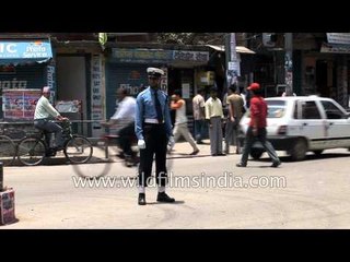 Nepal Prahari policeman blows whistle in Kathmandu's Putalisadak