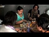 Indian transgender hijra lunches during a routine day of work