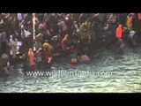 Hindu devotees gather to bathe in river Ganges during the Kumbh Mela - Haridwar