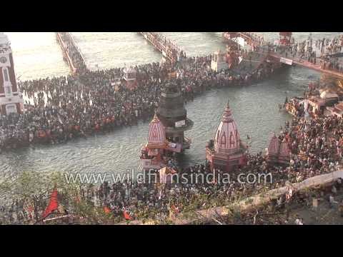Crowds of devout Hindus line the Ganga river as it emerges from the Himalaya
