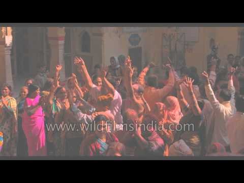 Indian revelers play Holi at Radha-Rani temple, Uttar Pradesh