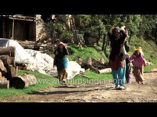 People carrying relief materials for their survival - Nepal