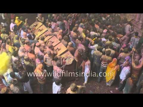 People coated with colours celebrate Holi at Vrindavan, India