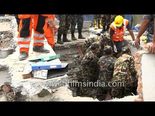 Rescue team takes out dead bodies from debris - Nepal earthquake