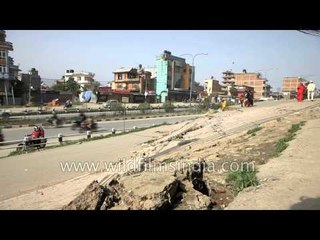 Damaged roads are seen after an earthquake on the outskirts of Kathmandu