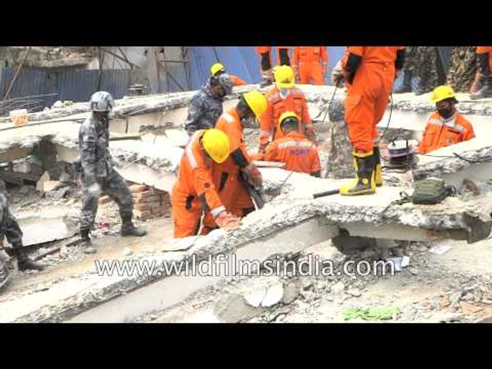 Indian National Disaster team search damaged houses in Nepal for survivors