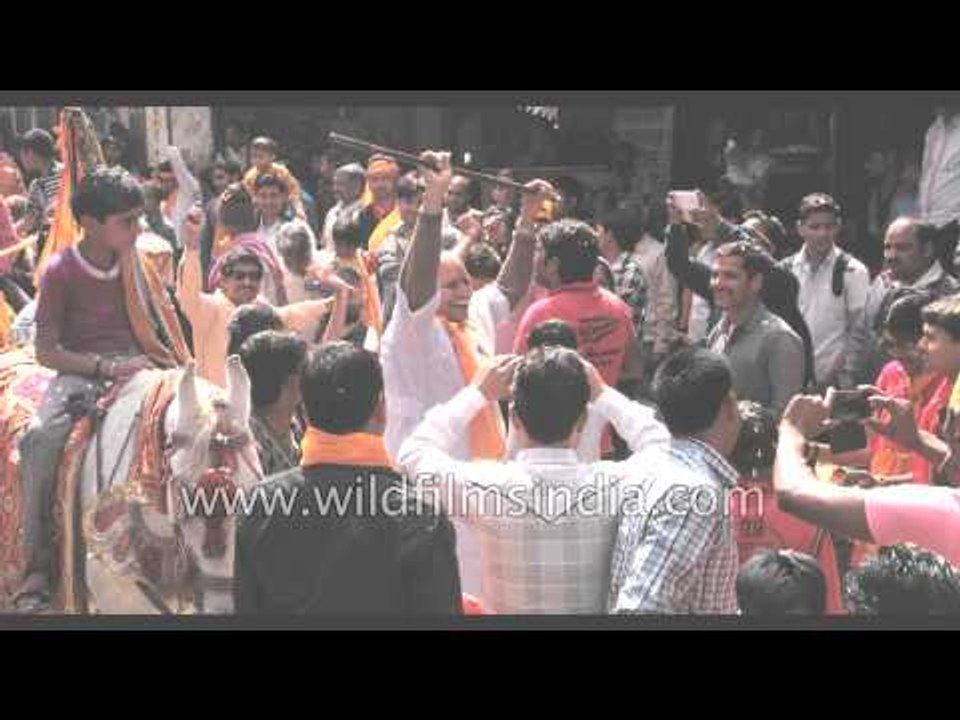 Street fest Holi with flower petals in Gokul, India