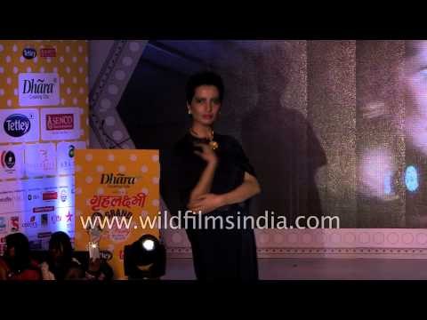 Indian models display glittery evening gowns - Delhi