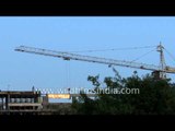 Construction crane with massively long boom in India