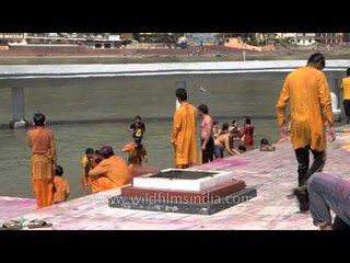 People bathe in Ganges post Holi celebration - Rishikesh