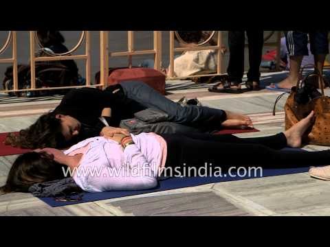 Foreigners relaxing under the sun on the banks of River Ganges