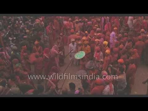 Women hitting hard and men protect themselves with shields