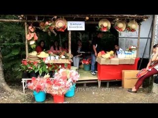Handicraft items like hats, baskets, necklaces at a stall in Mizoram