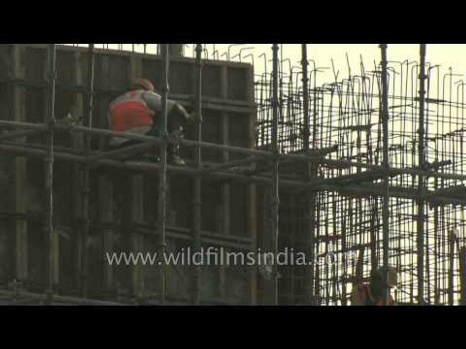 Building construction work in progress in Delhi: Indian economy thrives