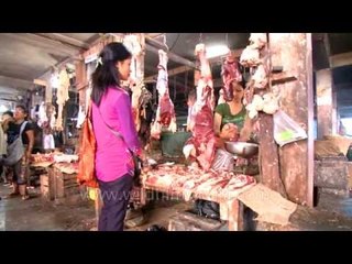 Women shop for prime cuts at meat market in Mizoram