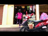 Young Mizo girl deliver goods at a shop in Aizawl, Mizoram