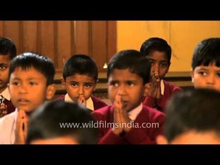 Indian school kids praying